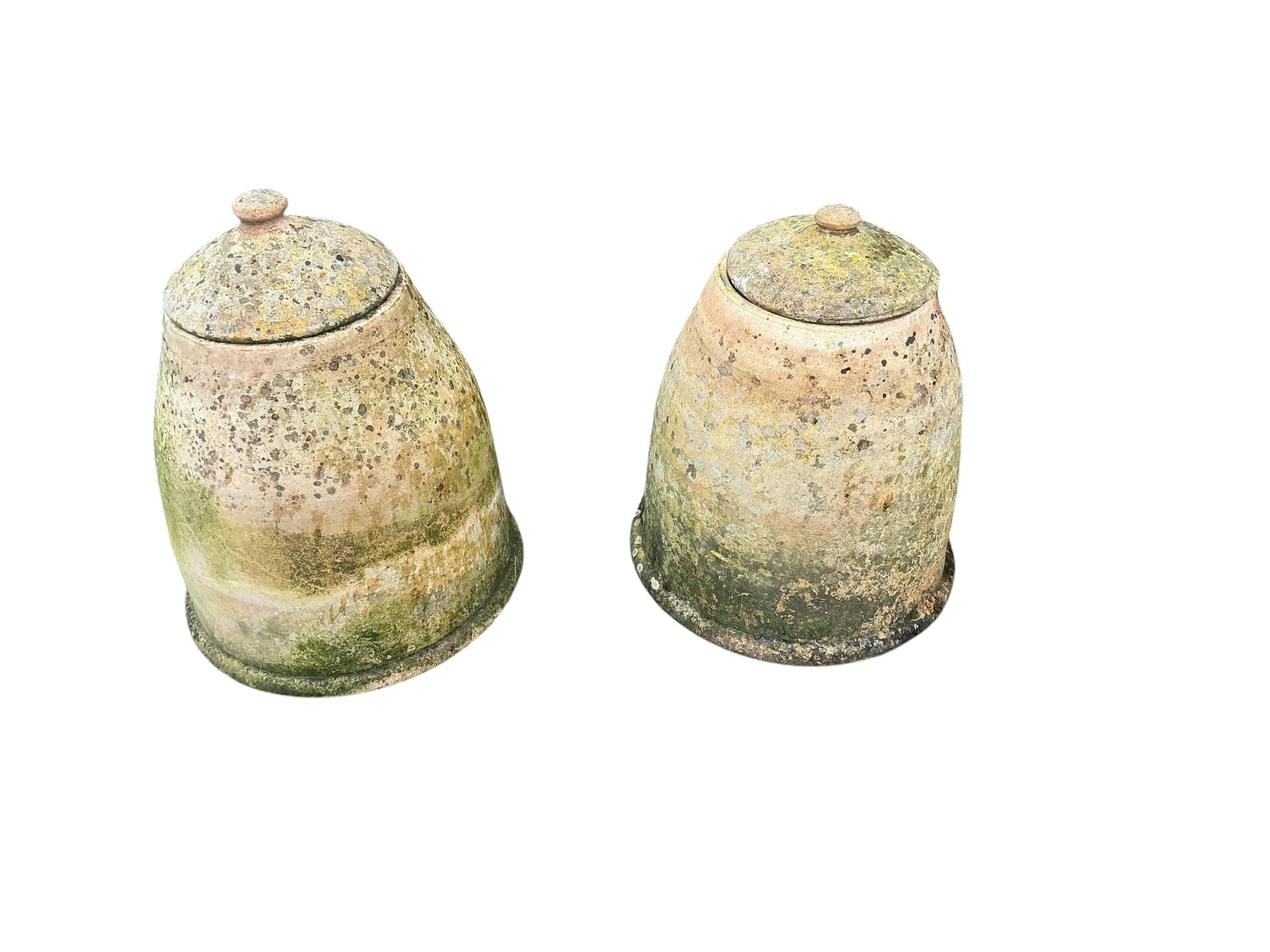 Two circular earthenware rhubarb forcers and covers, height 46cm
